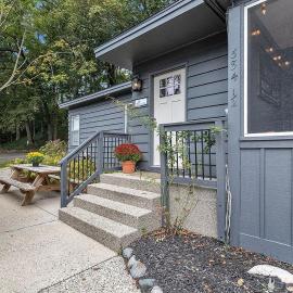 Screened porch pt water views hot tub walk to Saug