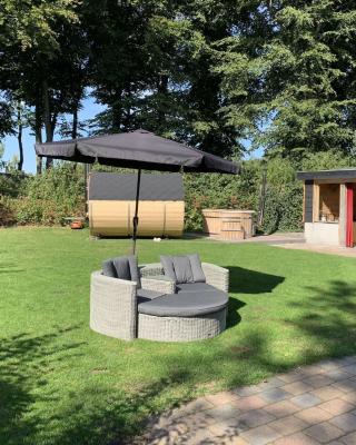 Holiday home with covered porch and sauna