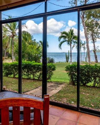 Warm Interiors and Orange Hues on Ground Floor in Front of Beach