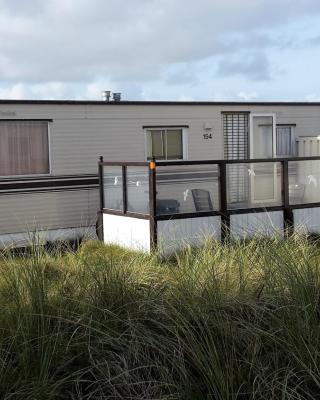AMELAND-Nes-Duinoord: Stacaravan (chalet) + fietsen direct aan zee!