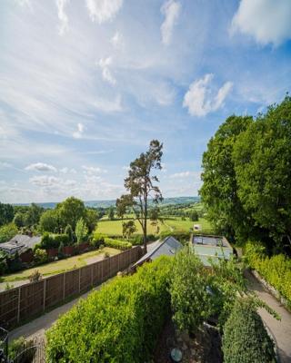 Cosy Snug with shower ensuite - It has beautiful countryside views - Only 3 miles from Lyme Regis, Charmouth and River Cottage - It has a private balcony and a real open fireplace - Comes with free private parking