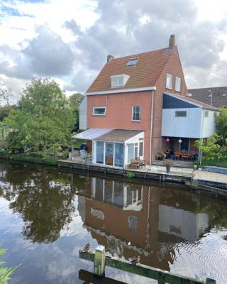 Characteristic detached house next to water