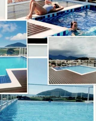 APARTAMENTO PRÓXIMO A PRAIA PISCINA E AREA GOURMET