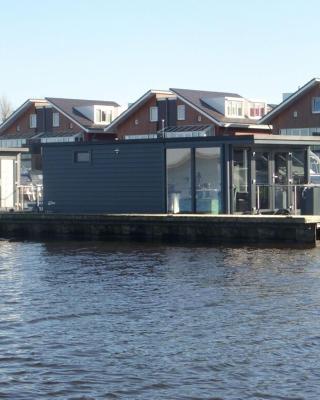 Modern houseboat with air conditioning located in marina