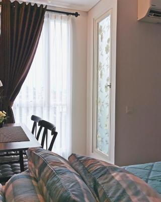 A Peaceful Room at Barsacity Apartment by Ciputra