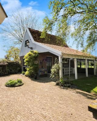 Idyllisch en knus huisje met prachtige veranda.