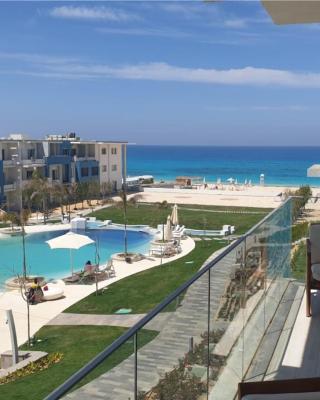 Fouka Bay North Coast 2BRs Modern Style Serviced Apartment with Open Pool & Sea View