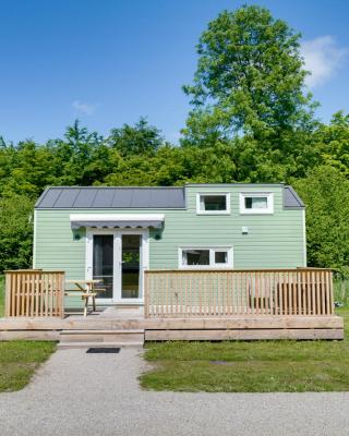 Green Tiny House with shared pool