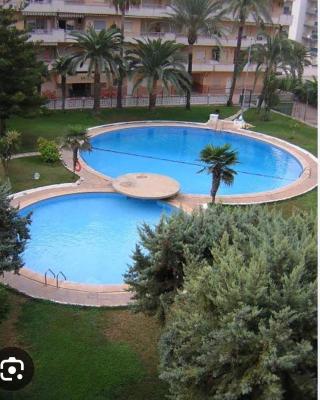 Acogedor apartamento en Daimús a 150 metros de la playa con parking privado y piscinas comunitarias