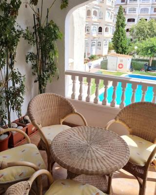 Nice and cozy flat with pool next to the beach