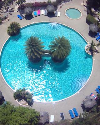 Kas di BaMi A-186 op Seru Coral Resort - Ruim appartement met groot zwembad en tropische tuin