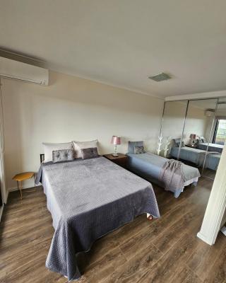 Book a Spacious room with a balcony for your stay with shared bathroom laundry kitchen and living area