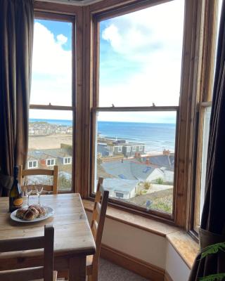 THE STONES a beautifully presented PRIVATE APARTMENT with far reaching VIEWS Over ST IVES HARBOUR and BAY and FREE ONSITE PARKING for LARGER GROUPS book along with our Connecting TWO SISTER APARTMENTS