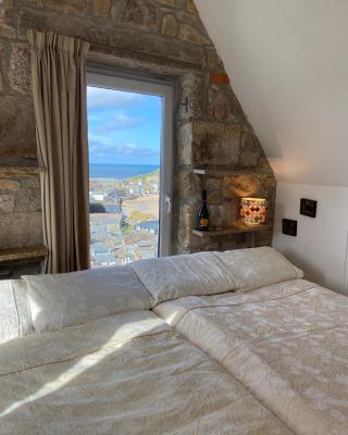 THE PENTHOUSE APARTMENT with an 18ft by 14ft balcony with amazing VIEWS over ST IVES HARBOUR and BAY perfect from Alfresco dining and sunbathing, ONSITE PARKING, LARGER GROUPS book our connecting apartments