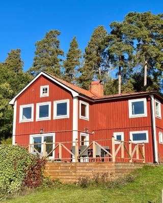 Flemma Gård The lake view with sauna