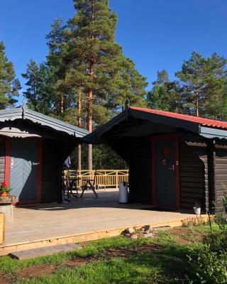 Timber cottages with jacuzzi and sauna near lake Vänern