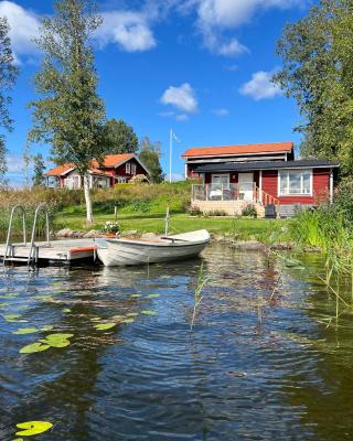 Sommarstuga med sjötomt och brygga