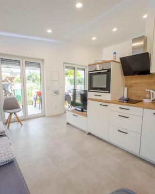 Neubau Wohnung mit Terrasse im EG