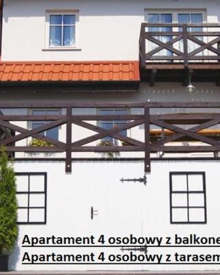 Apartamenty i pokoje Mikołajki