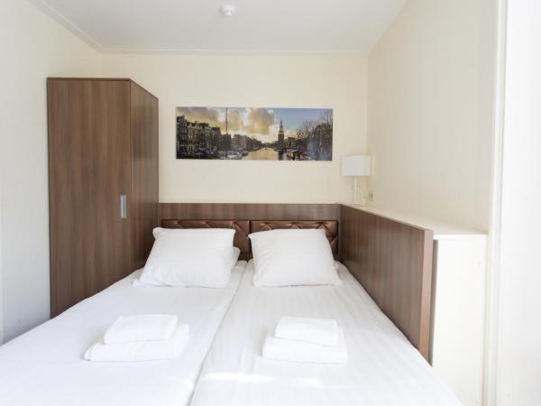 Hotel Park Plantage : photo 1 de la chambre petite chambre lits jumeaux souterrain