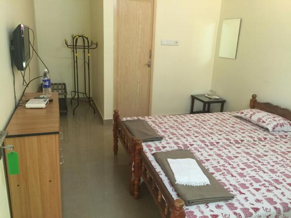 Palm Grove Service Villa : photo 1 de la chambre chambre double standard avec ventilateur