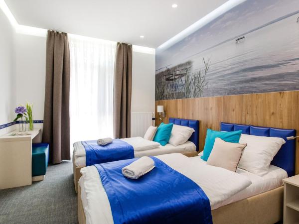Hotel Solero : photo 1 de la chambre chambre lits jumeaux - vue sur jardin