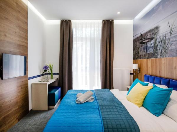 Hotel Solero : photo 6 de la chambre chambre lits jumeaux - vue sur jardin