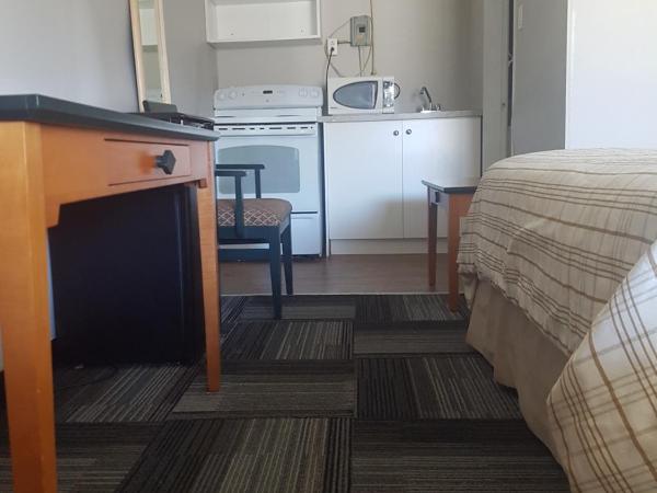 Olympia Lodge : photo 3 de la chambre chambre lit queen-size standard avec kitchenette