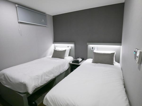 Philstay Myeongdong Station : photo 4 de la chambre chambre lits jumeaux