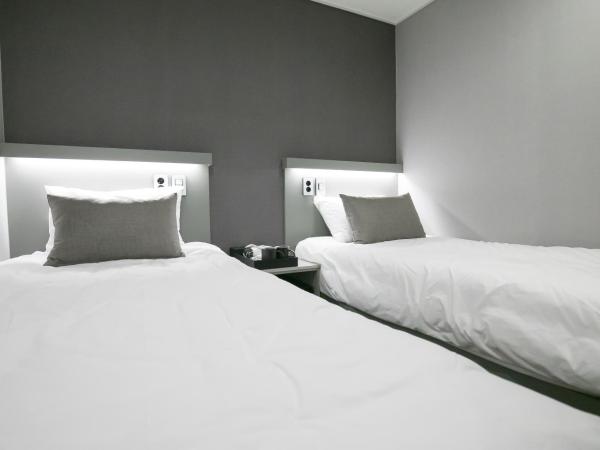 Philstay Myeongdong Station : photo 8 de la chambre chambre lits jumeaux