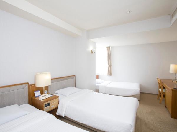 Tetoranze Makuhari Inagekaigan Hotel : photo 1 de la chambre chambre triple