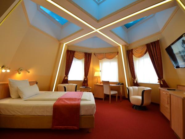 Hotel Mack : photo 1 de la chambre chambre lit queen-size avec baignoire spa