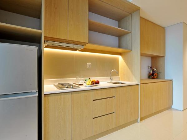 Midtown Residence Surabaya : photo 5 de la chambre fabuleux hébergement lit king-size