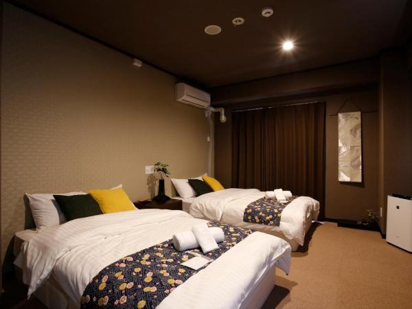 Sumiya Spa & Hotel : photo 2 de la chambre chambre lits jumeaux supérieure avec salle de bains commune