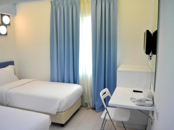 YY318 Hotel Bukit Bintang : photo 2 de la chambre chambre lits jumeaux deluxe