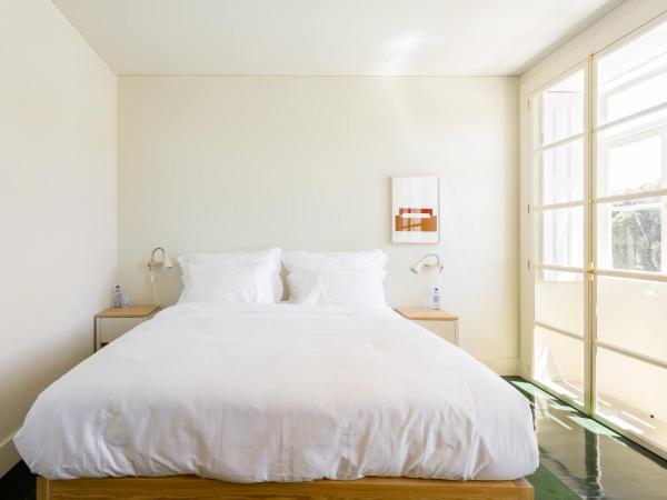 Duas Portas Townhouse : photo 2 de la chambre chambre deluxe - vue sur rivière