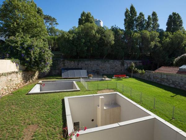 Duas Portas Townhouse : photo 6 de la chambre chambre triple - vue sur jardin