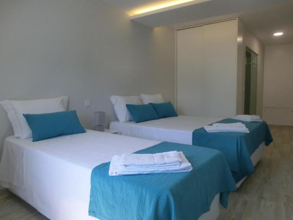 Enjoy Viana - Guest House : photo 8 de la chambre chambre triple premium avec salle de bains privative