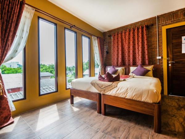 Pongphen Guesthouse - SHA Plus Certified : photo 7 de la chambre chambre double deluxe