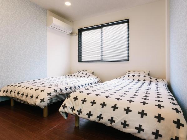 Guest House Yasuragi Hakataekimae : photo 1 de la chambre chambre lits jumeaux standard