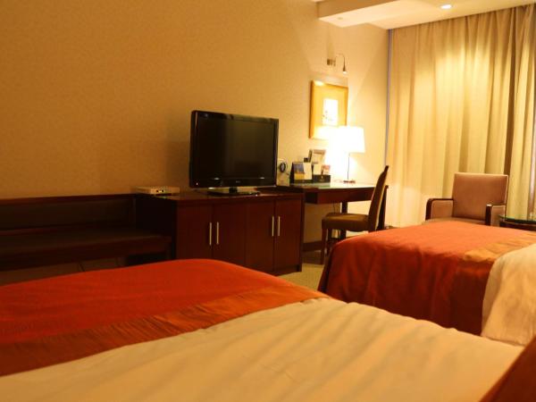 Jinling Jingyuan Plaza : photo 6 de la chambre chambre lits jumeaux deluxe