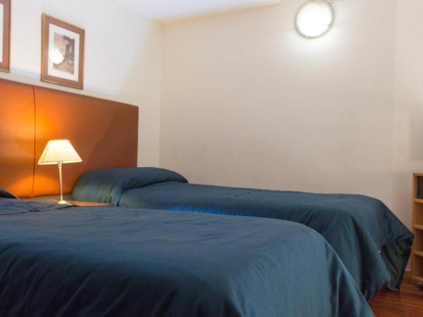 Rosario Suites : photo 4 de la chambre appartement lits jumeaux standard