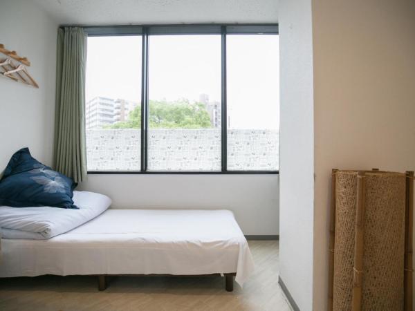 123 Guesthouse : photo 2 de la chambre triple room with shared bathroom - b