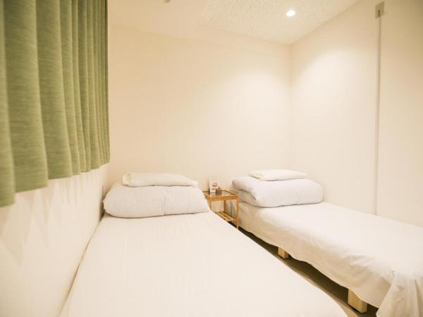 123 Guesthouse : photo 1 de la chambre twin room with shared bathroom - e