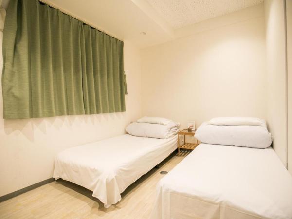 123 Guesthouse : photo 3 de la chambre twin room with shared bathroom - e