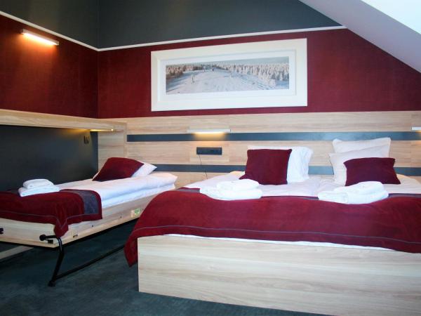 Villa Winterpol : photo 4 de la chambre chambre triple supérieure