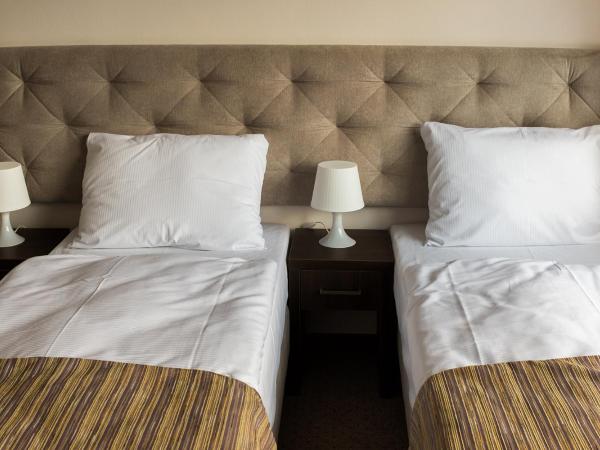 City Rooms Szczecin : photo 1 de la chambre chambre lits jumeaux
