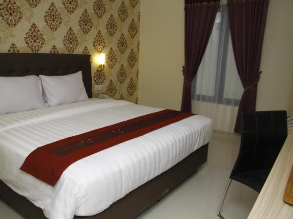 Hersya Front One Inn Surabaya : photo 3 de la chambre chambre double deluxe