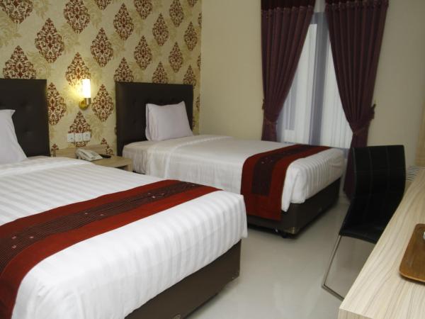 Hersya Front One Inn Surabaya : photo 4 de la chambre chambre lits jumeaux deluxe