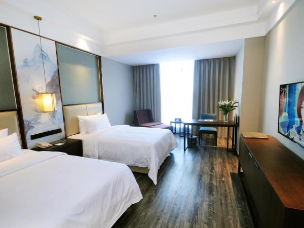 Airport Jianguo Hotel : photo 4 de la chambre chambre lits jumeaux deluxe